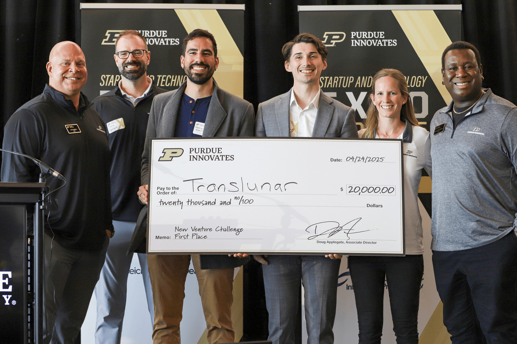Translunar team receiving the \$20 000 first‑place check at the New Venture Challenge